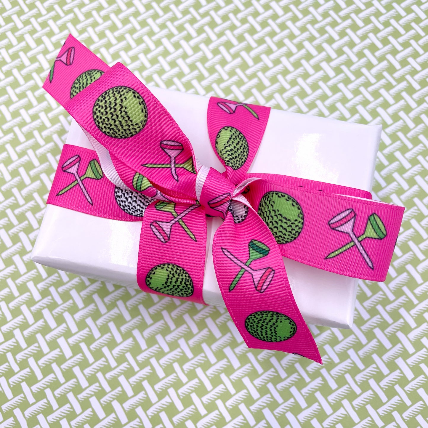 Woman's golf ribbon featuring golf balls and tees on a pink background ...