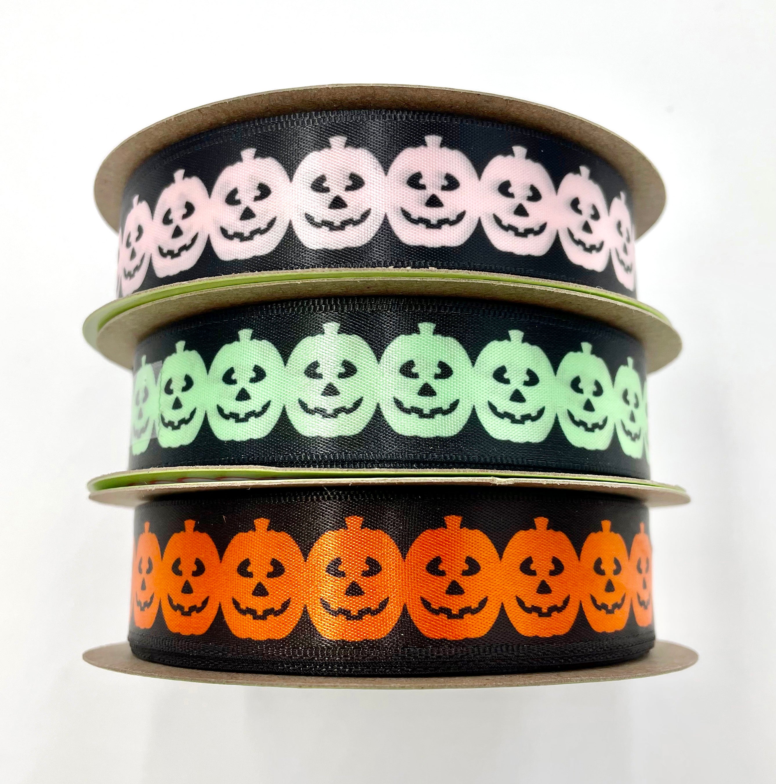 Pumpkin garland ribbon Halloween in orange, pink and mint green on a b