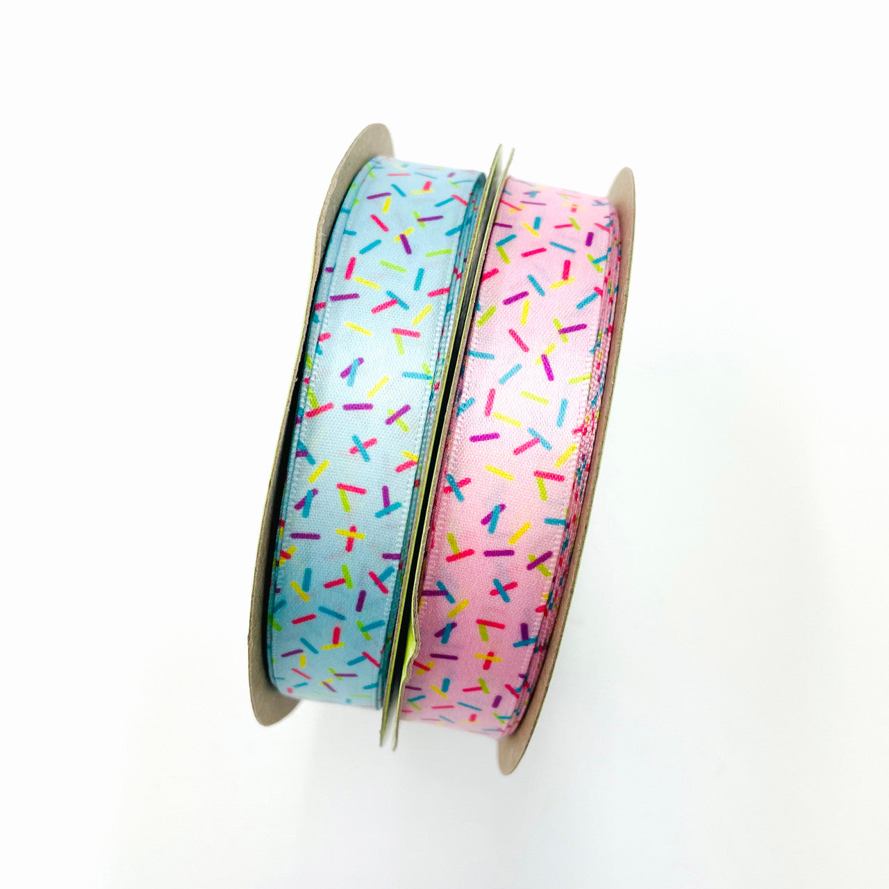 Sprinkles ribbon sprinkles in rainbow colors on a blue or pink background printed on 5/8" white single face satin,