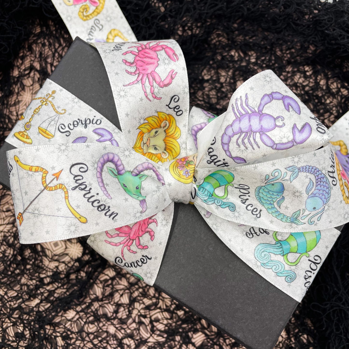 Tie a gorgeous bow on a gift with this truly unique astrology themed ribbon.