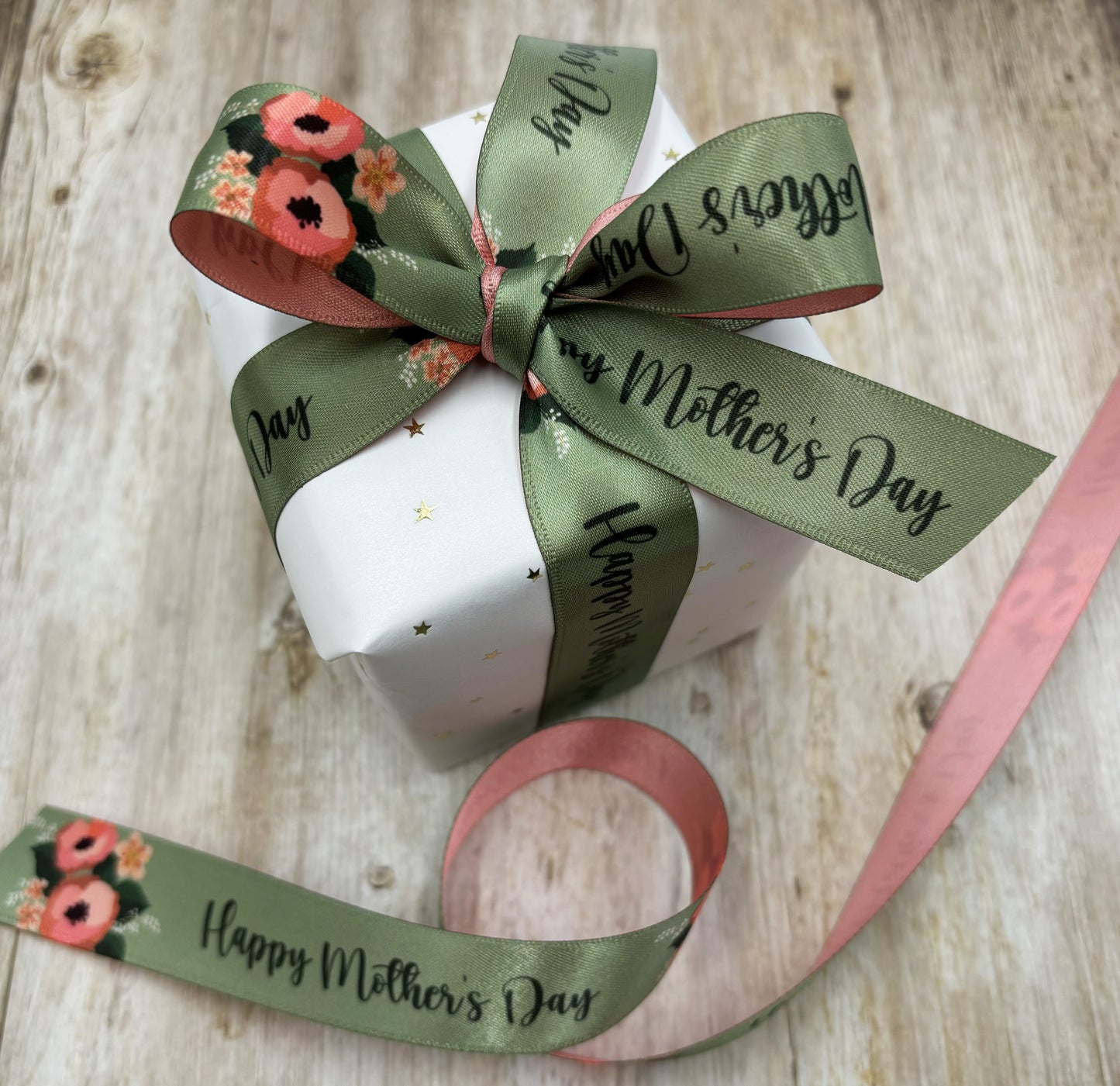 Happy Mother's Day Ribbon coral flowers with Happy Mother's Day on a sage green background and coral backing printed on 7/8" white satin