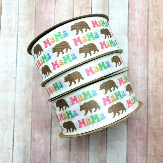 Mama Bear ribbon Mama Bear in pastel letters of pink, yellow and blue with a brown bear printed on 5/8" and 1.5" satin and grosgrain ribbon