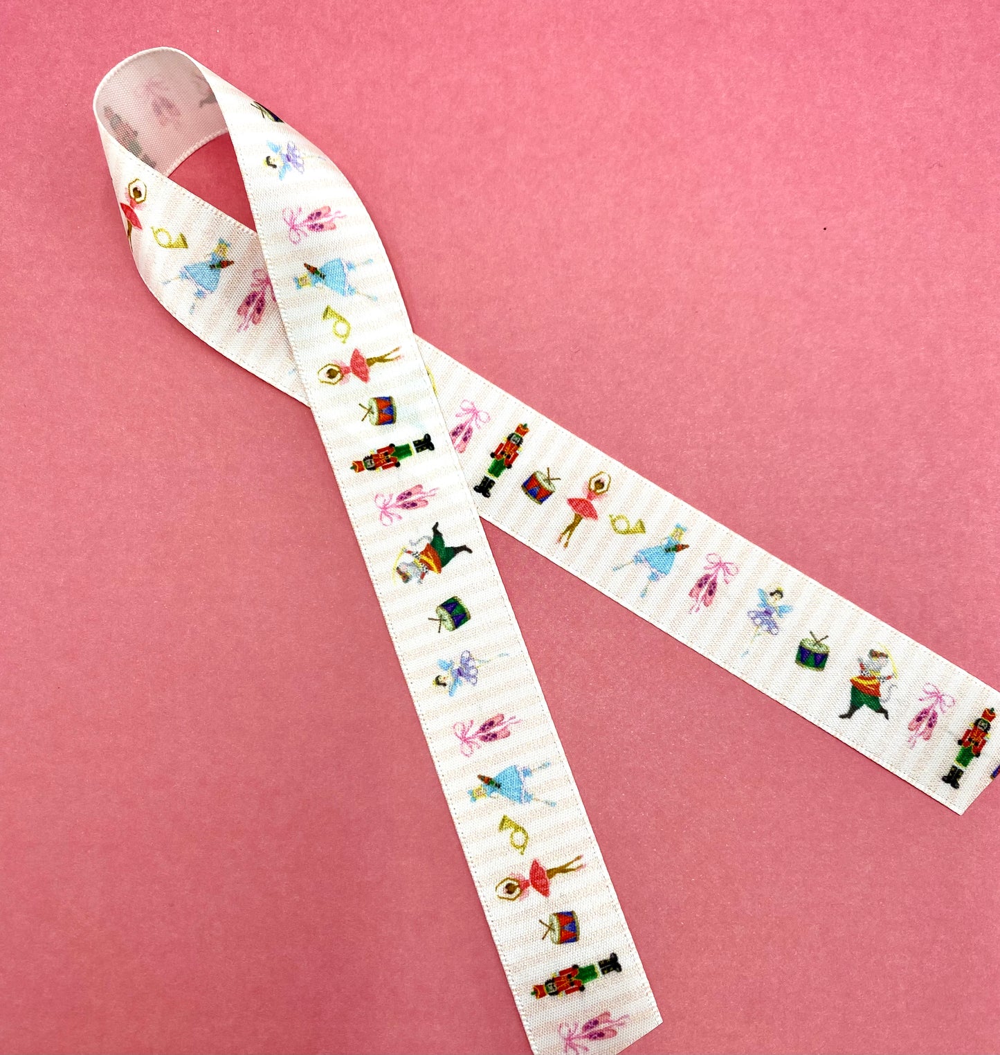 Nutcracker Ballet ribbon featuring all the characters printed on 5/8", 7/8" and 1.5" white satin