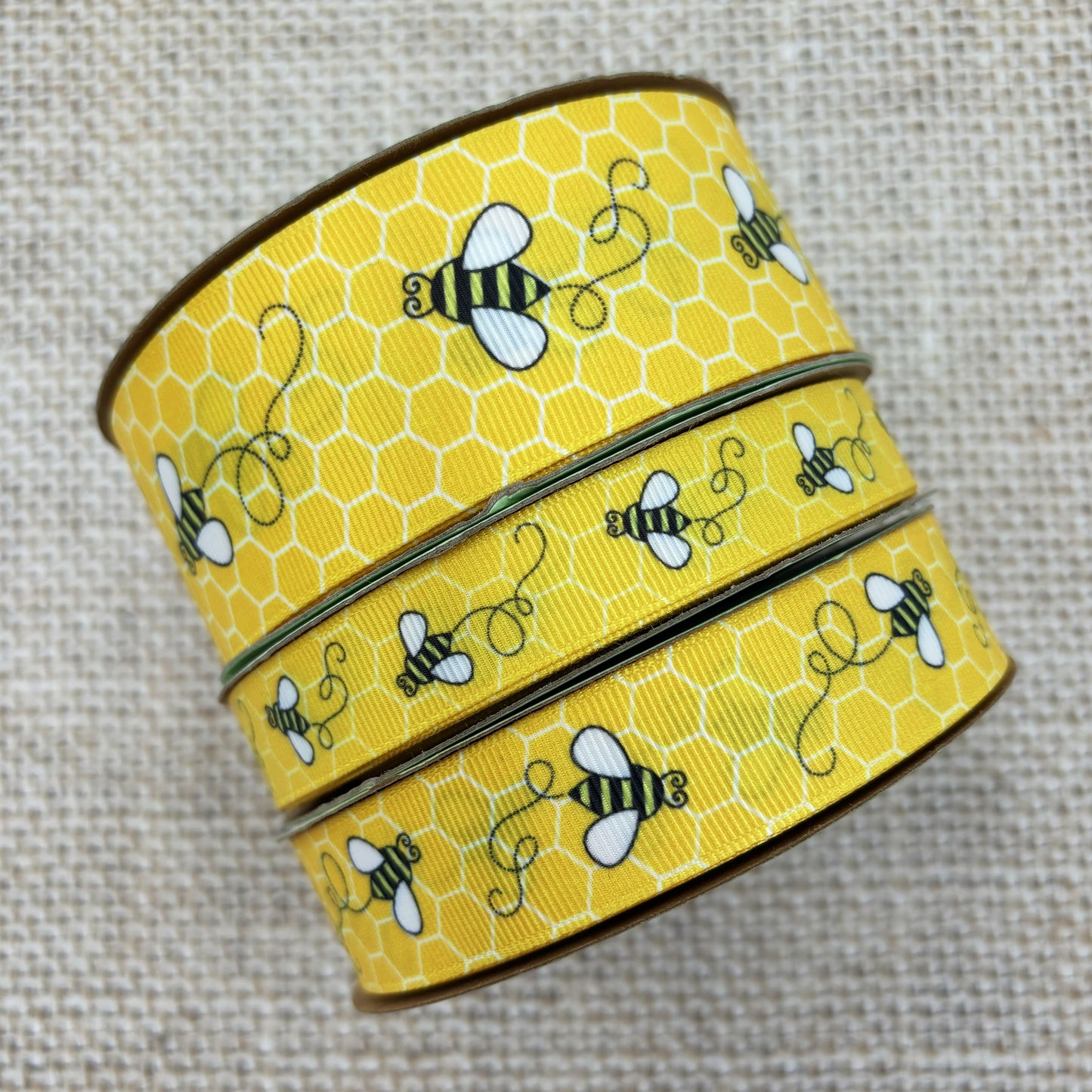 Buzzing Bees Ribbon with a yellow comb printed on 5/8", 7/8" and 1.5"  white grosgrain