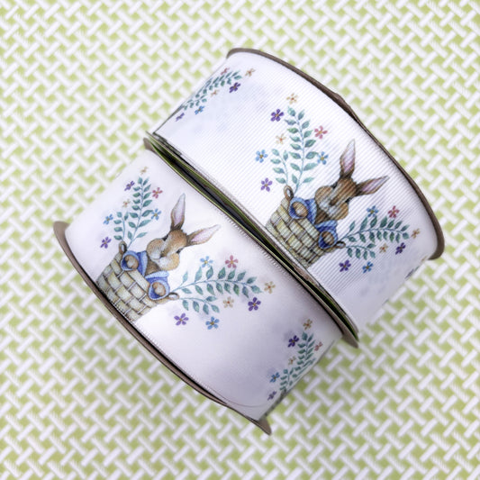 Bunny ribbon Easter bunny pops out of a basket with sprigs of Spring flowers printed on 1.5" white satin and grosgrain