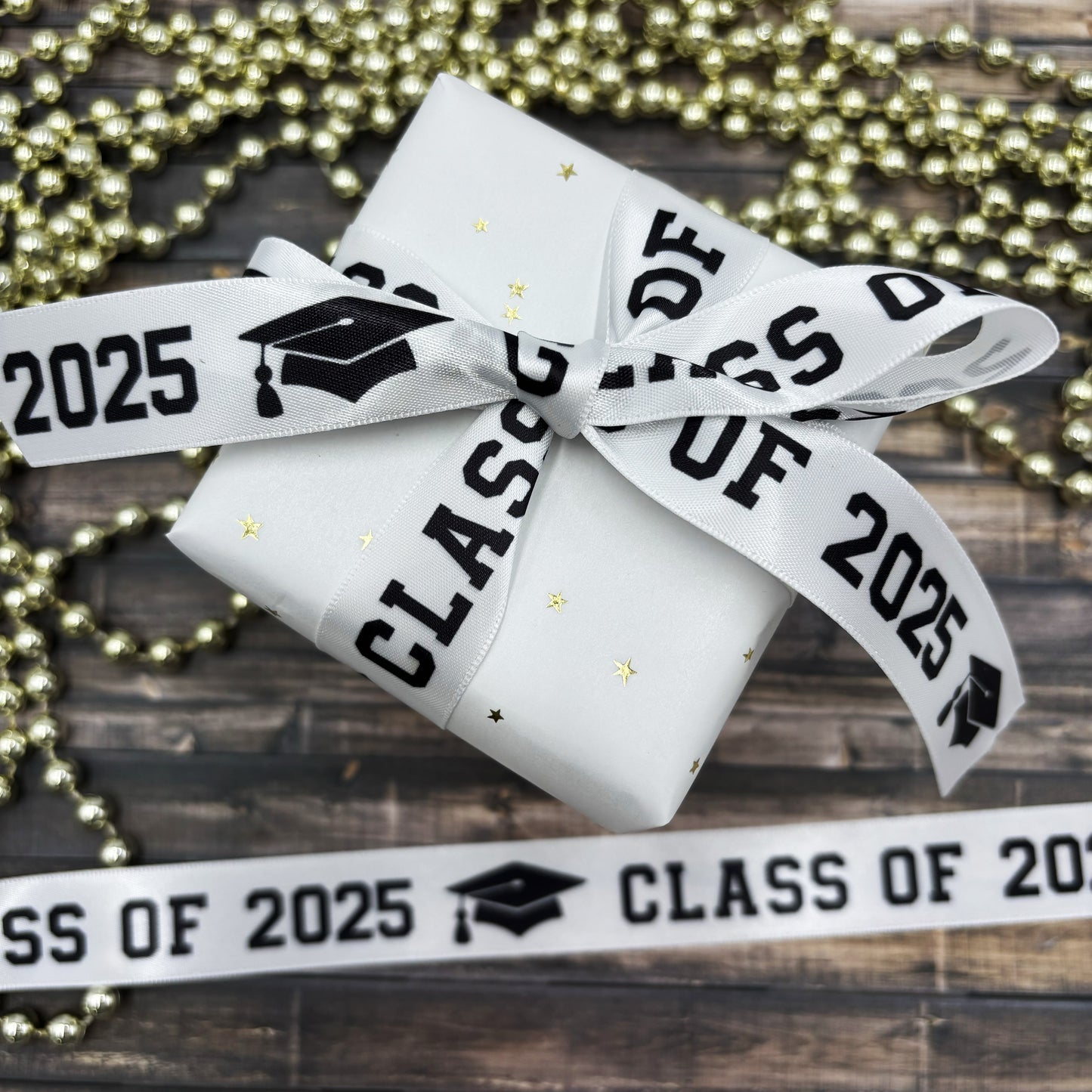 Graduation Class ribbon Class of 2025 in black with a black mortar board printed on 5/8" and 7/8" satin and grosgrain