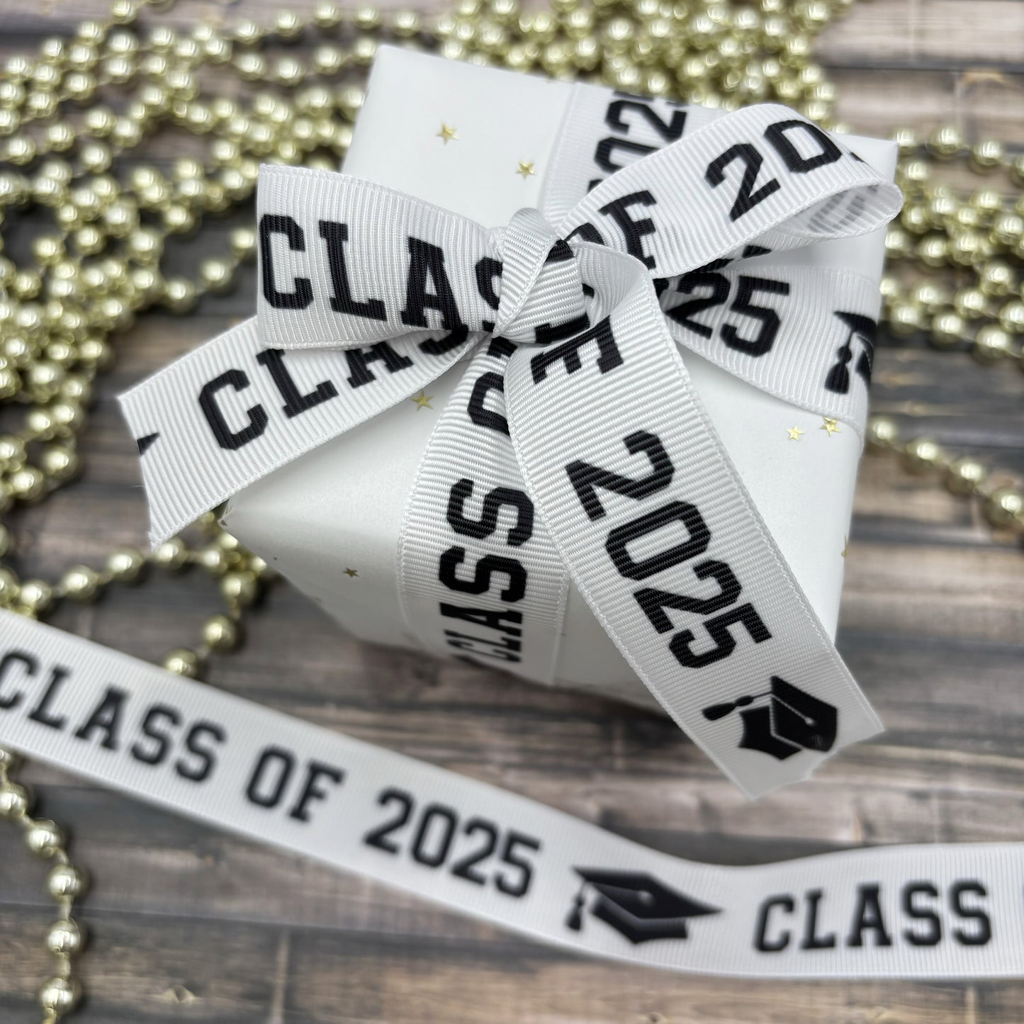 Graduation Class ribbon Class of 2025 in black with a black mortar board printed on 5/8" and 7/8" satin and grosgrain