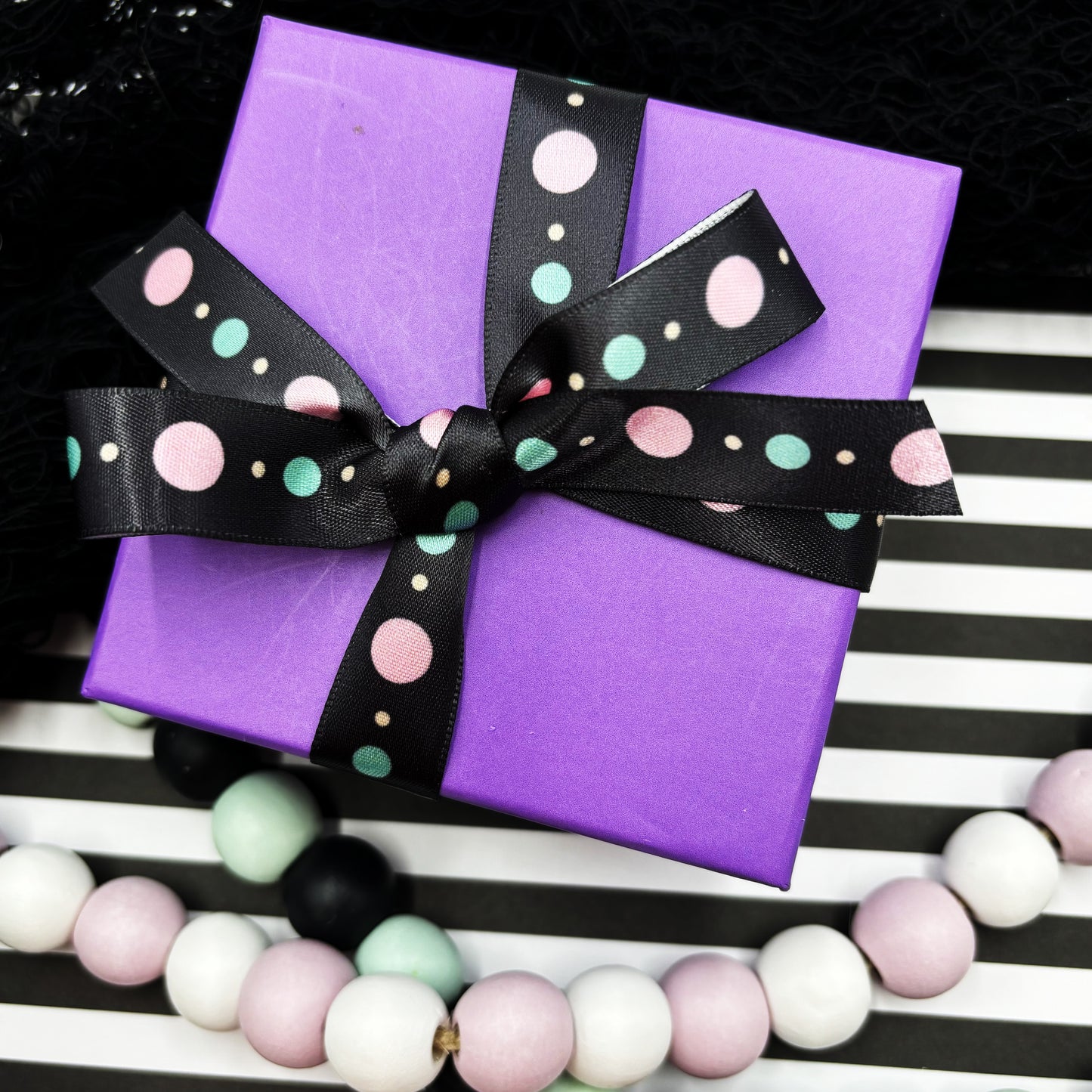 Halloween dots in two variations pastels with purple and tradtional with black printed on 5/8" satin