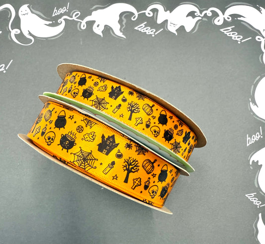 Halloween Ribbon tossed elements of skulls, haunted houses, cauldrons, scary trees and more in black printed on 5/8" and 7/8" tangerine single face satin