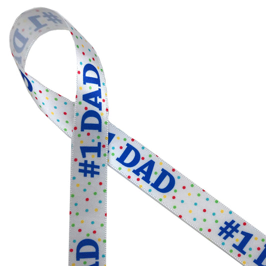 #1 DAD printed in royals blue with polka dots tossed on the background in primary colors printed on 5/8" white single face satin ribbon is the ideal ribbon for Dad on his special day! This is a great ribbon for party decor, party favors, gift wrap, card making, scrapbooking and collage! Printed in the USA