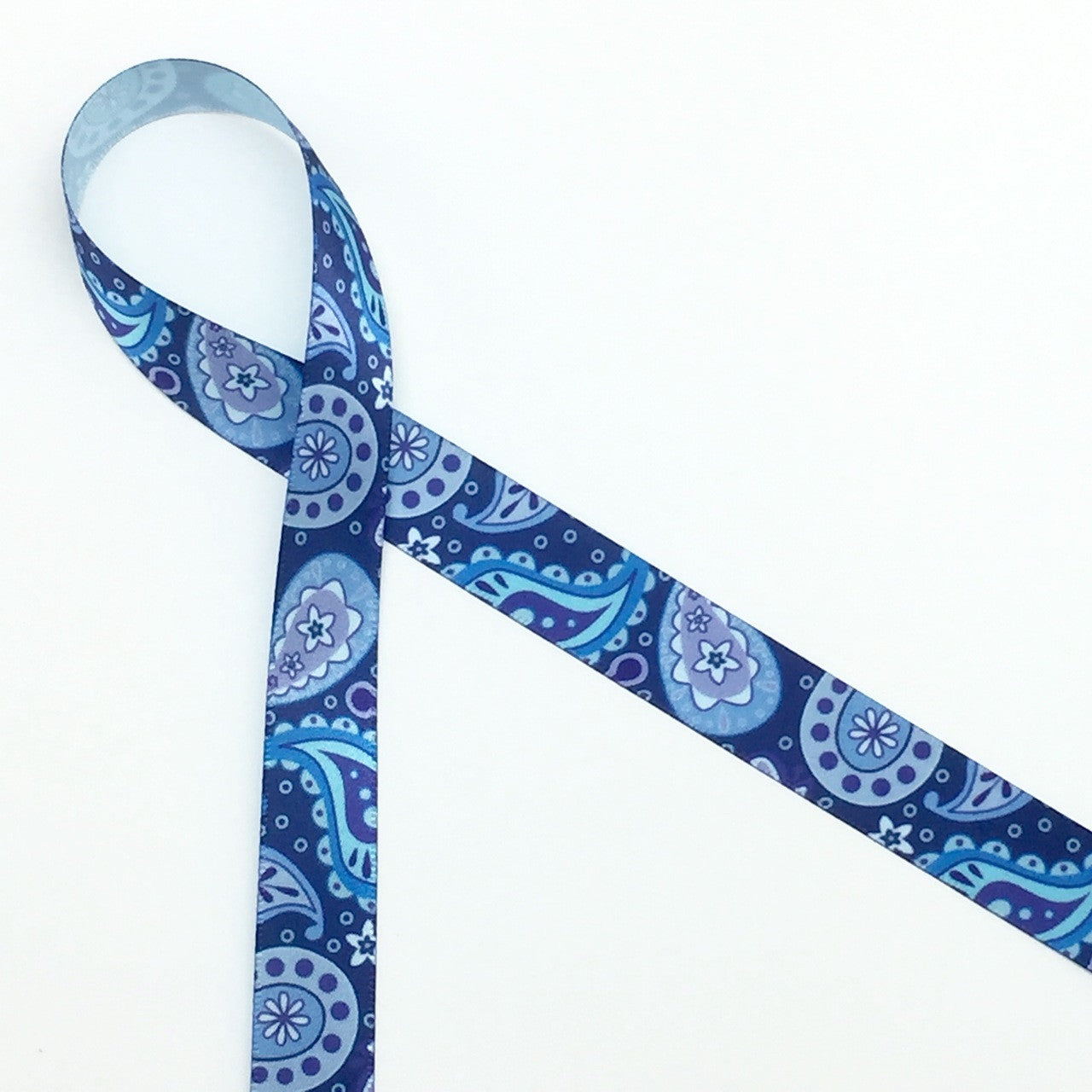 Blue paisley printed on 5/8" Lt. blue single face satin ribbon is a versatile ribbon for themes from Mother's Day and Father's Day to a casual wedding!