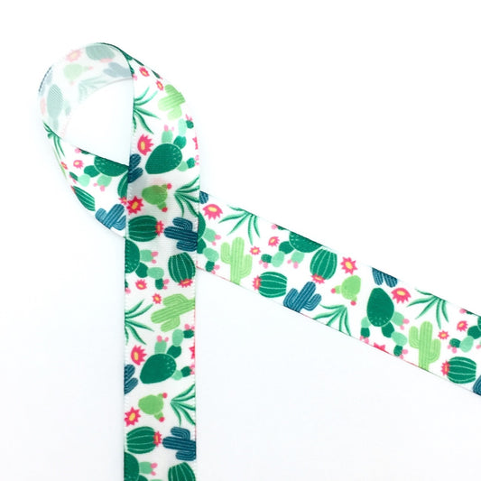 Our cactus design on 5/8" white single face satin features cacti and cactus flowers tossed on a white background. Make your next Southwest themed party extra fun by tying favors with our cactus ribbon!