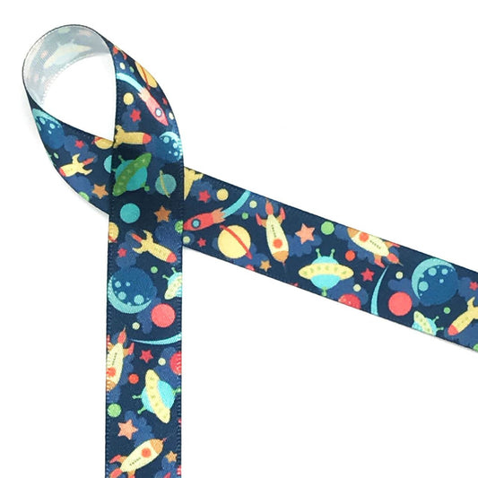 Spaceships, flying saucers, rockets, stars and planets in primary colors float along a navy blue background on 5/8" white single face satin. This is the perfect ribbon for tying favors at any little boy's birthday party!