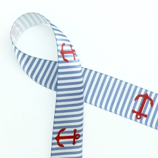 Anchors aweigh! Red anchors line up on a light blue and white striped background printed on 7/8" white single face satin ribbon. This slightly masculine design is ideal for a beach themed wedding grooms men gifts, gift wrap ribbon, grooms gift ribbon, party favors, center pieces, floral design, and party decor. Use this ribbon for nautical the beach themed crafts, sewing and quilting projects too! All our ribbon is designed and printed in the USA