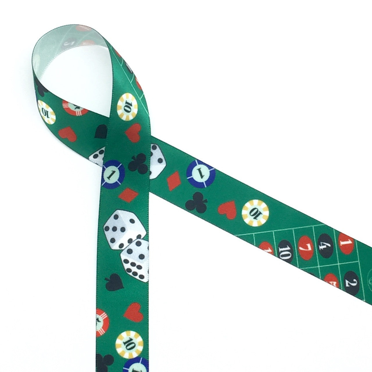 Casino themed ribbon with dice, chips, hearts, diamonds, clubs and spades.