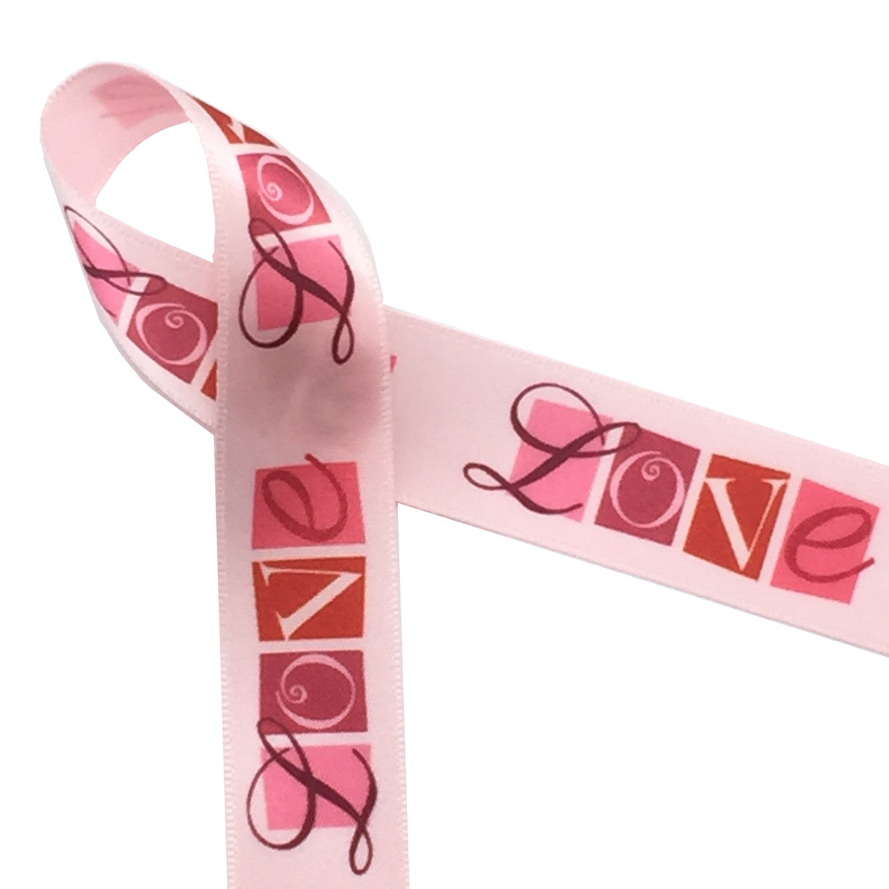 There is nothing like expressing you LOVE on Valentine's Day! Our love word block ribbon on 7/8" light pink satin will make the statement for you when you tie a gift for that special someone!
