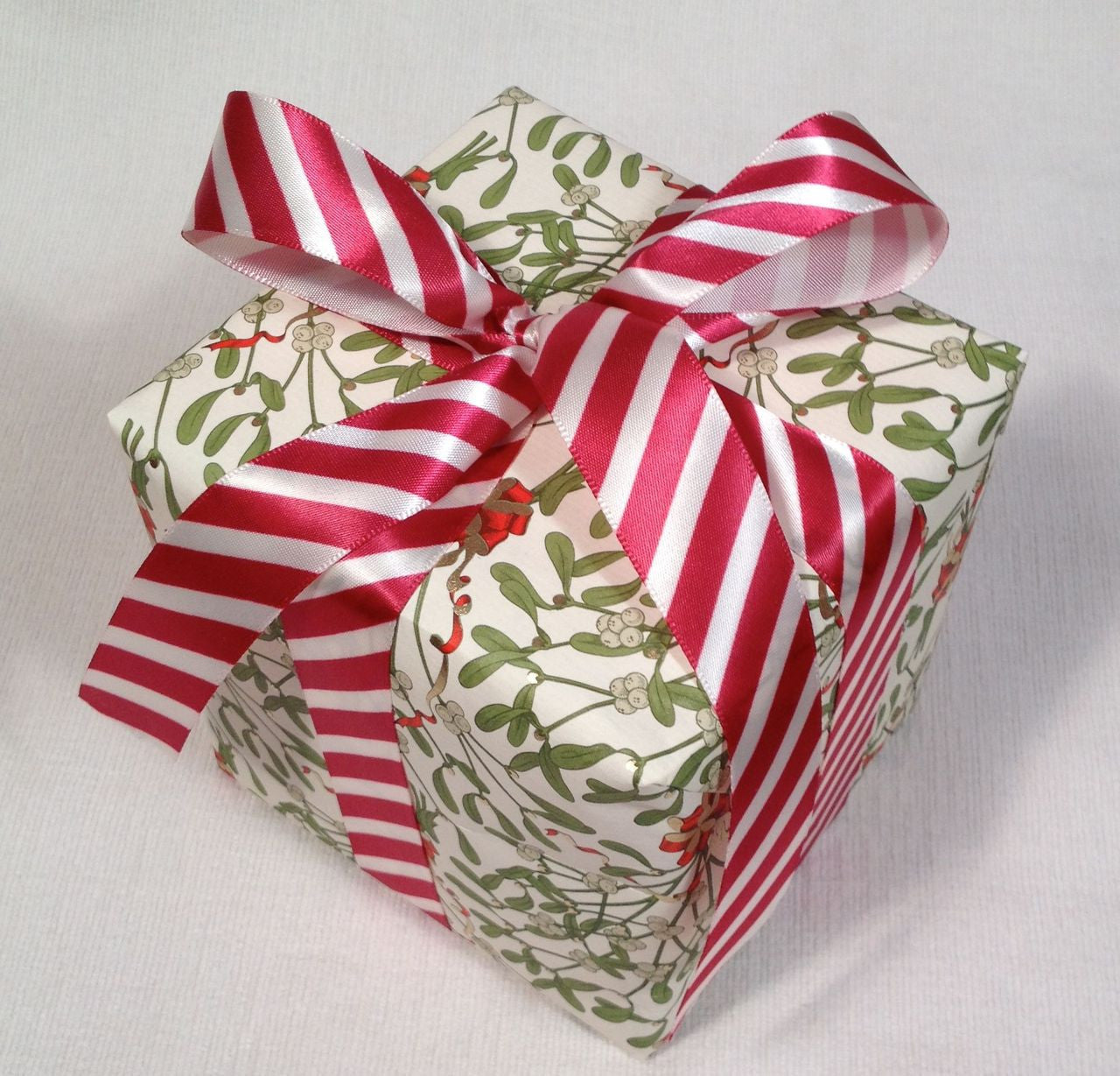 A pretty little gift all tied up in a stripped bow!!