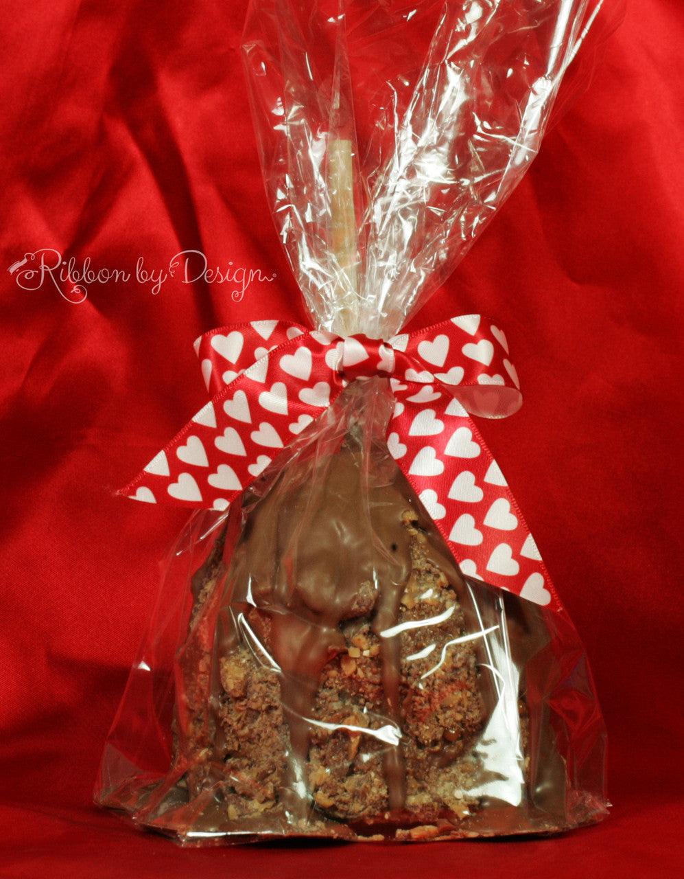 A delicious chocolate dipped caramel apple all dressed up in our 7/8" Pink hearts Valentine ribbon.