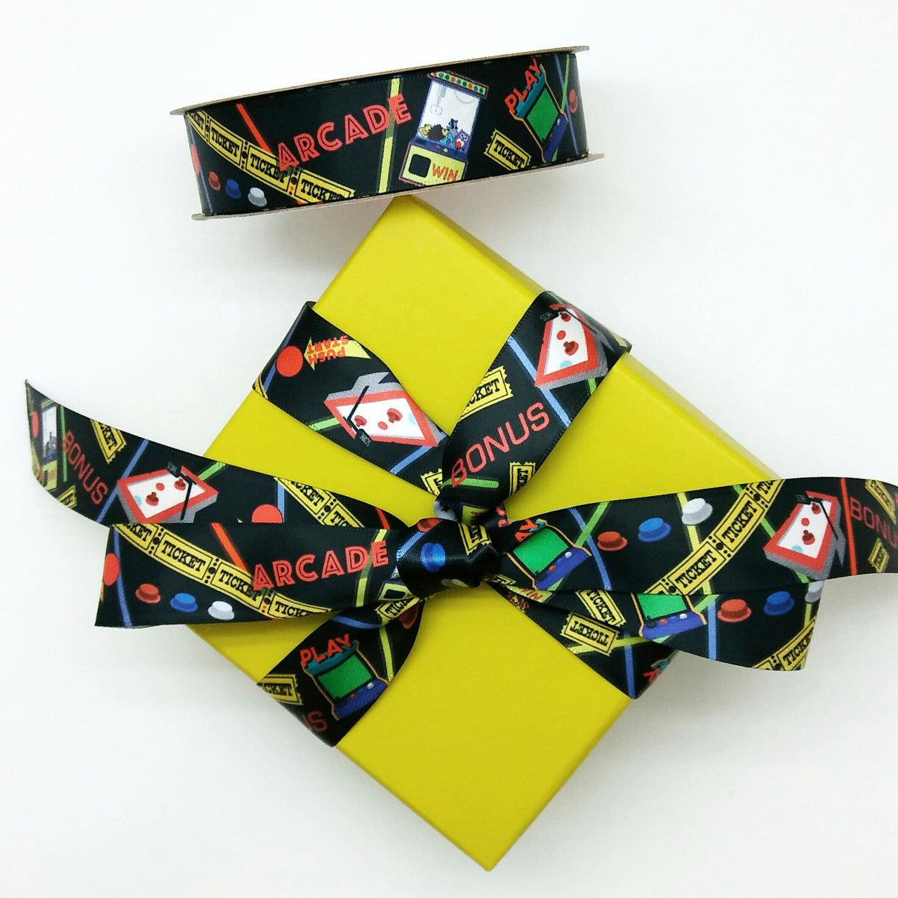 Tie our Arcade themed ribbon on a fun colored box to carry the theme of the party to the next level! Designed and printed in the USA