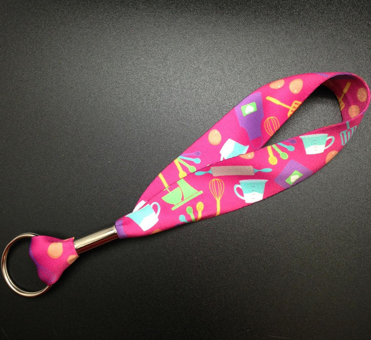 Key Fob with Baking elements on a Pink background on 1" Webbing