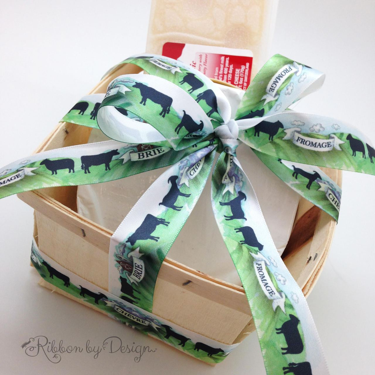 This beautiful cheese basket tied with our cheese themed ribbon is a great gift for the cheese lover in your life!