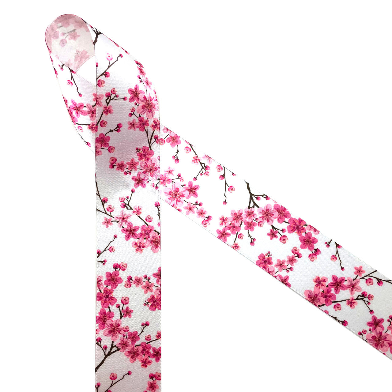 Cherry Blossoms are a sure sign of Spring! Beautiful pink cherry blossoms on brown branches printed on 1.5" white single face satin ribbon are perfect for every Spring event! This is a fabulous ribbon for Mother's Day, bridal showers, Cherry blossom festivals, floral design, quilting and Spring sewing projects! All our ribbon is designed and printed in the USA