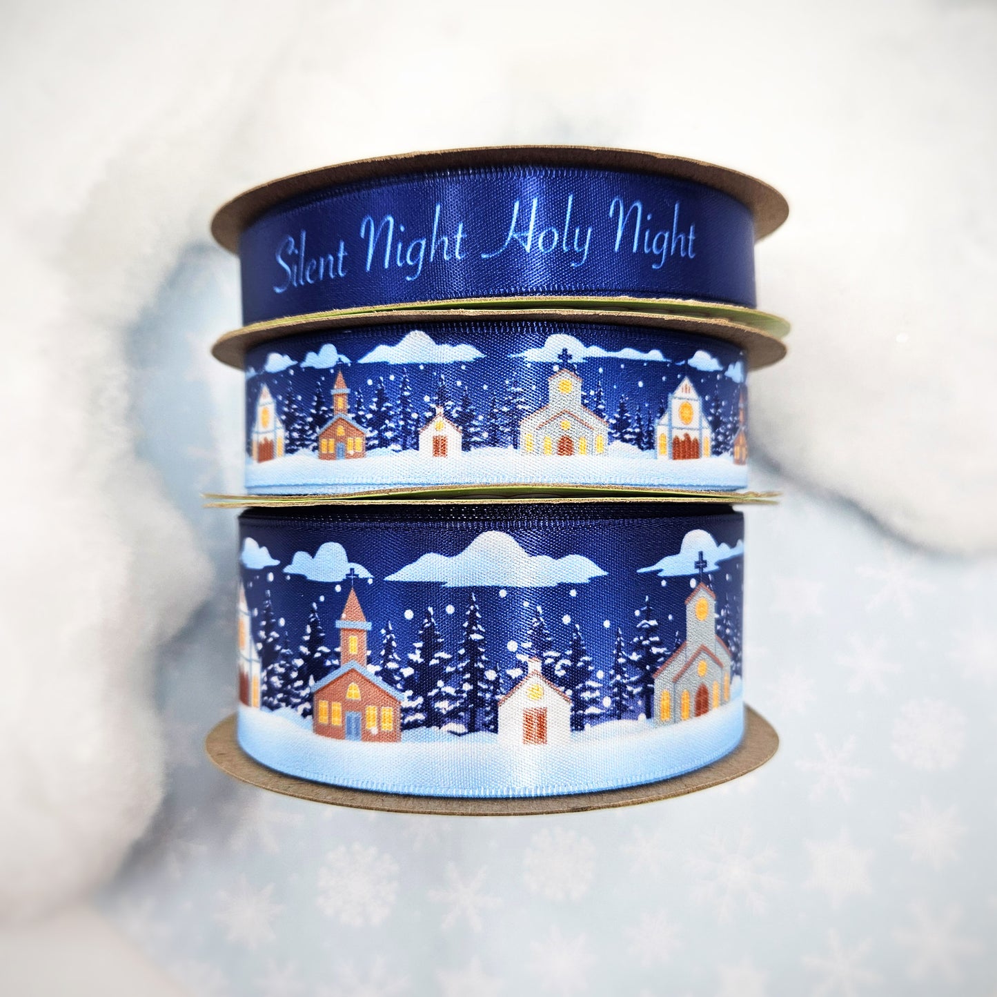 Churches in the snow on a navy blue background with pine trees and snowfall printed on 7/8 and 1.5" white single face satin