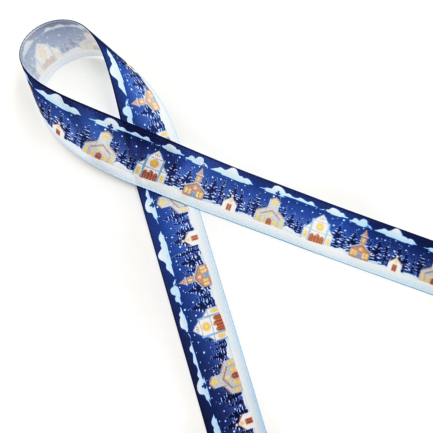 Churches in the snow on a navy blue background with pine trees and snowfall printed on 7/8 and 1.5" white single face satin