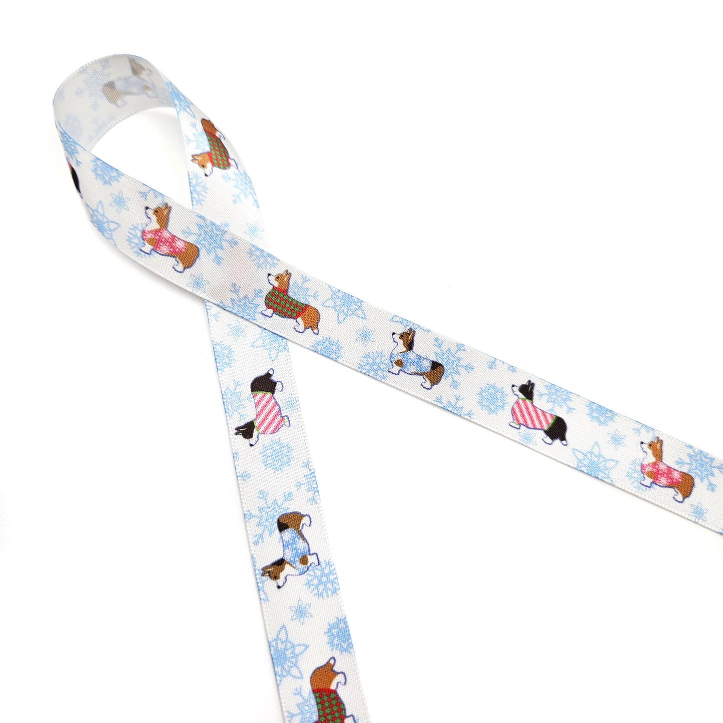 Dog Ribbon Corgi's in Holiday sweaters with snowflakes in the background printed on 5/8" and 7/8"white  single face satin
