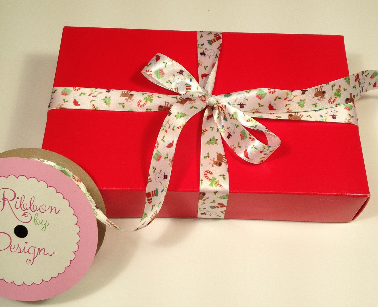 A red box tied with Christmas All Around is a wonderful gift for anyone!