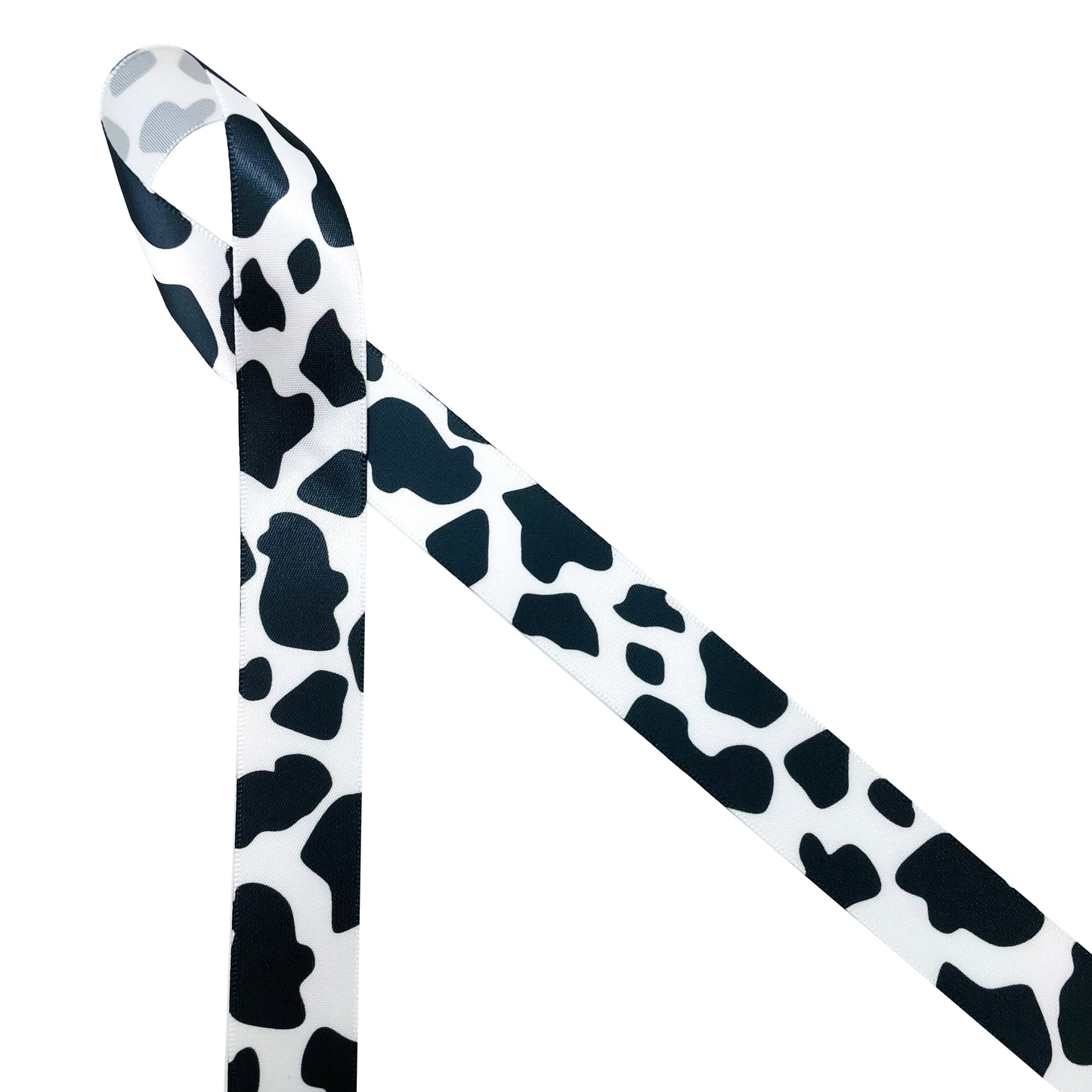 Cow print ribbon in black and white printed on 5/8", 7/8" and 1.5" white  satin