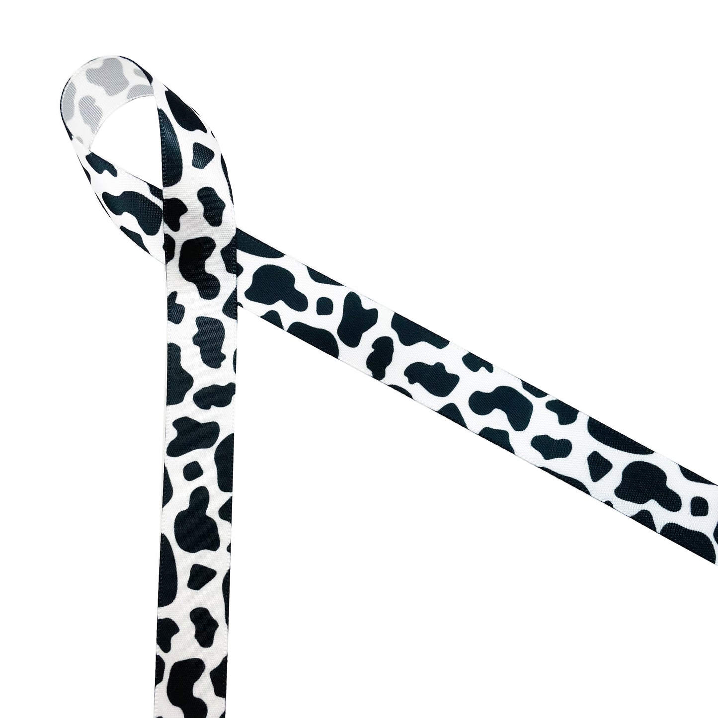 Cow print ribbon in black and white printed on 5/8", 7/8" and 1.5" white  satin