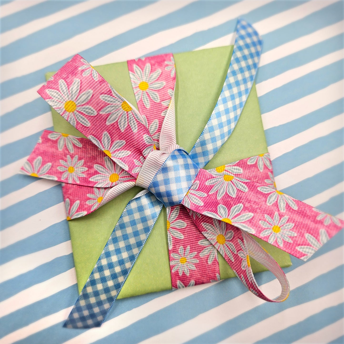 Daisy ribbon daisy blossoms on a watercolor blue  or pink background printed on 7/8" grosgrain