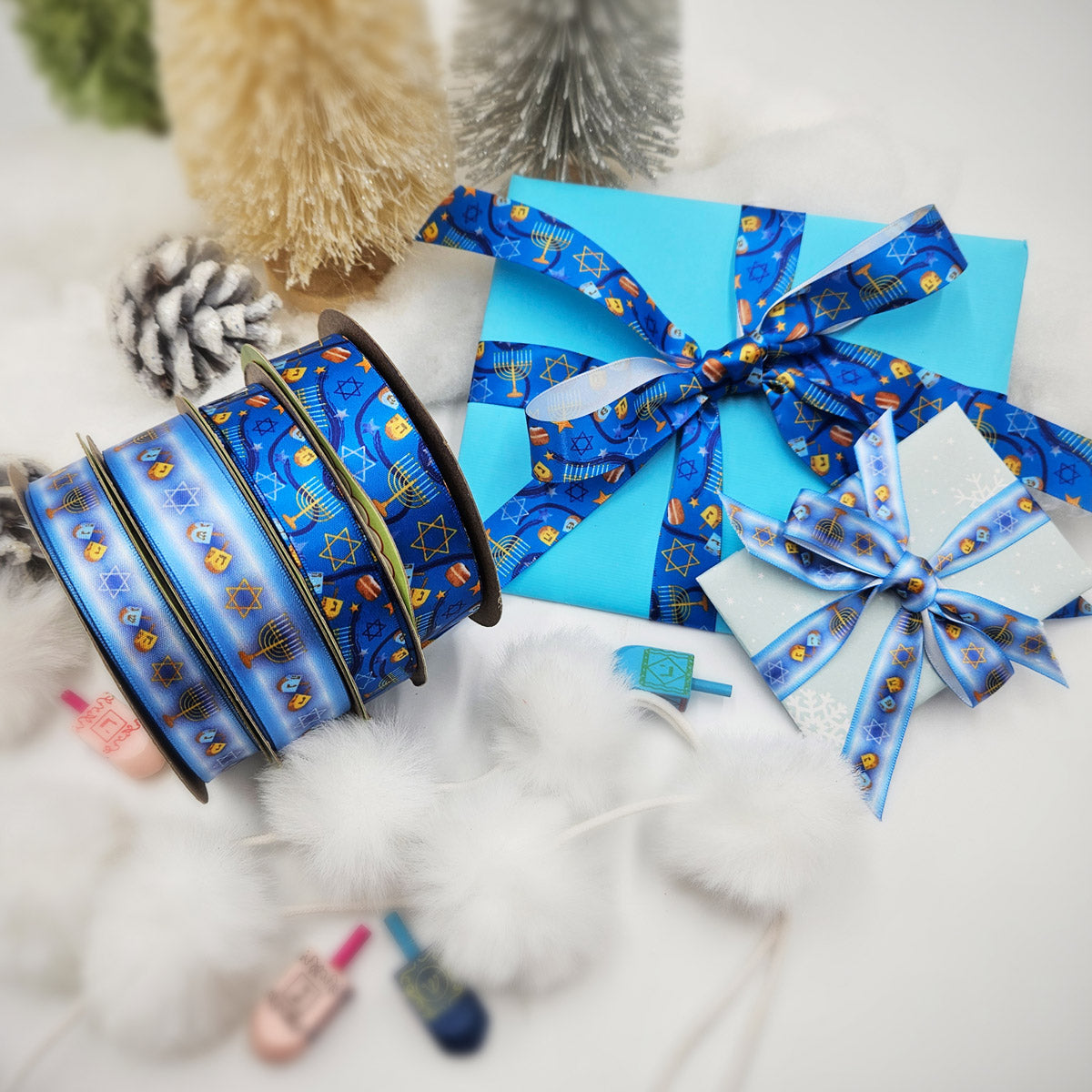 Hanukkah Ribbon in shades of dark blue with Menorahs, dreidels and Star of David tossed for decor printed on 5/8" and 7/8" white satin