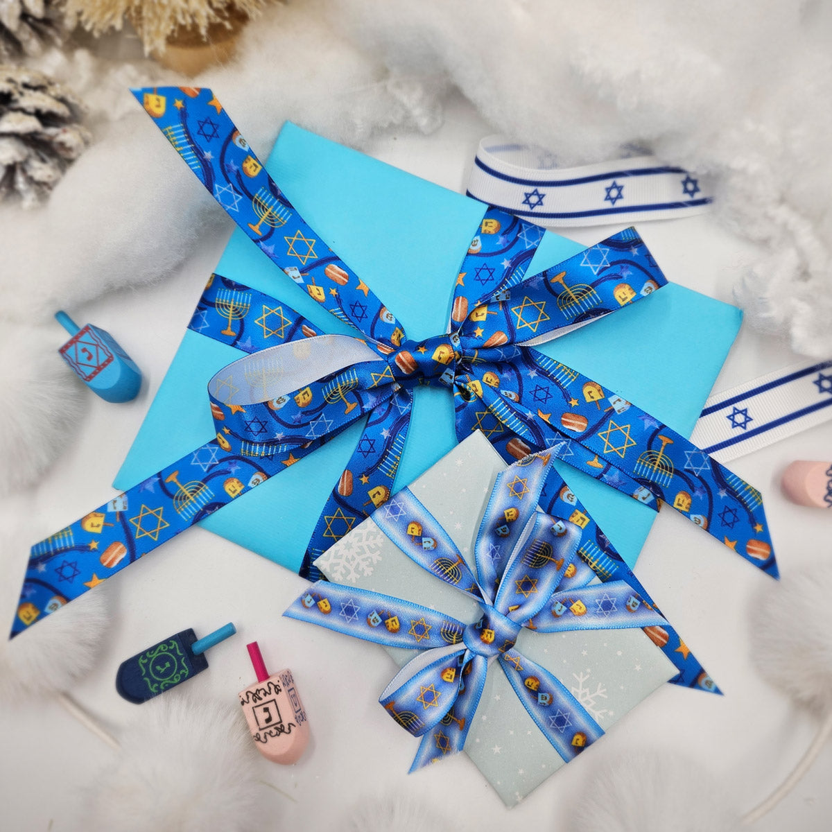 Hanukkah Ribbon in shades ofLight  blue with Menorahs, dreidels and Star of David in a row for gifts printed on 5/8" and 7/8" white satin