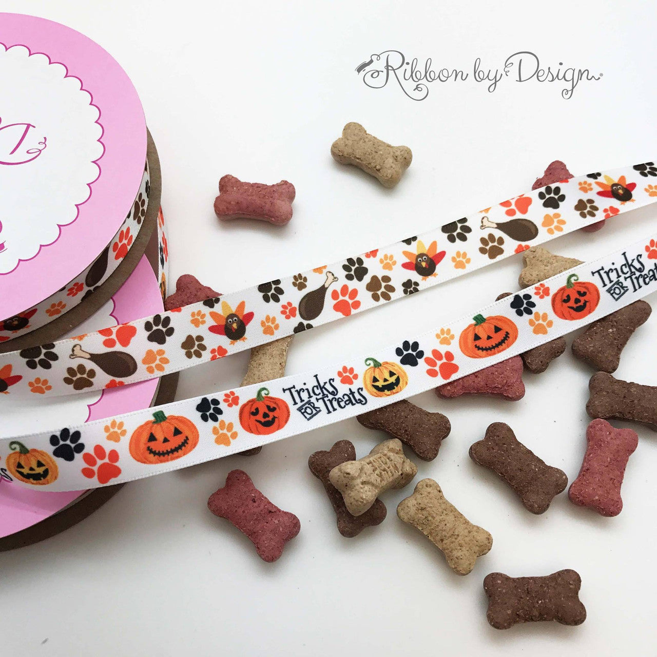 Tricks for Treats ribbon with paw prints and Jack O' Lanterns for pets printed  on 5/8" white single face satin