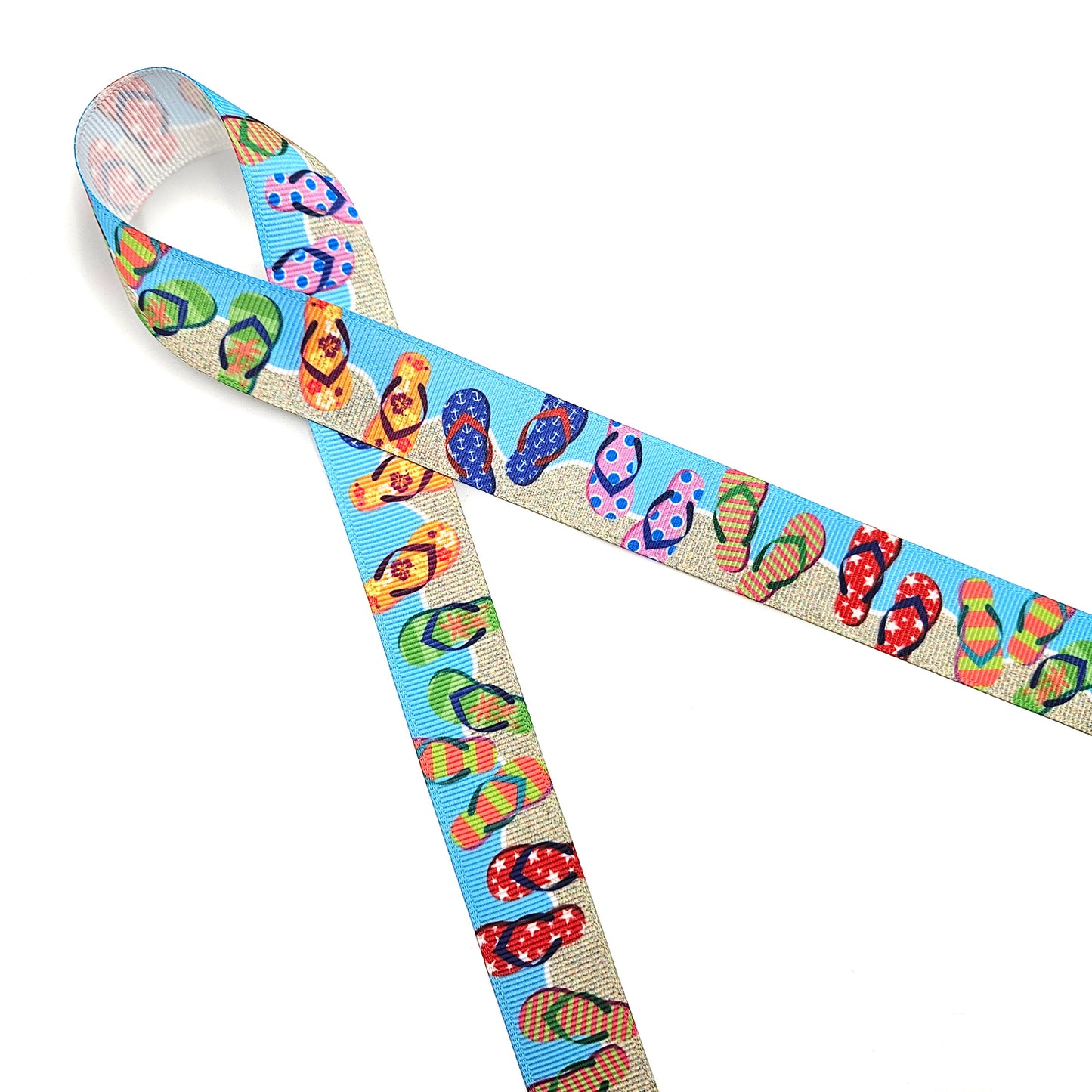 Flip Flop ribbon colorful flip flops in stripes, stars, and floral designs on a sand and blue background printed on  5/8" and 7/8" white single face satin and grosgrain