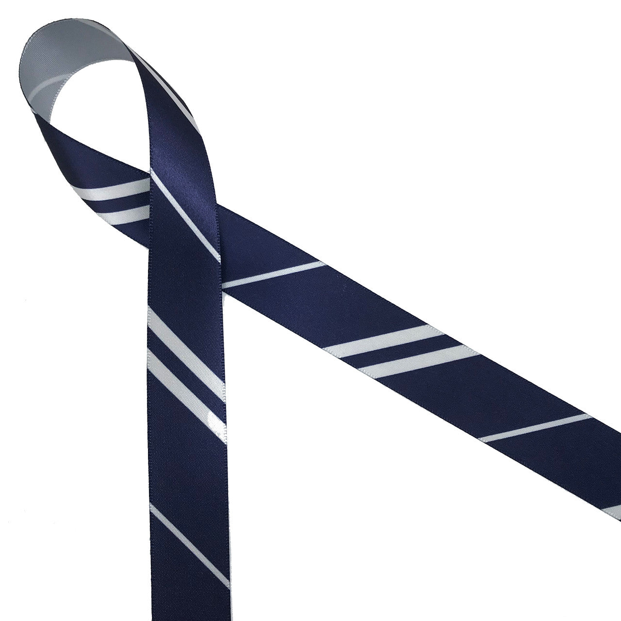 Wide and narrow stripes of gray and navy blue printed on 7/8" gray single face satin ribbon is an ideal addition to any Hogwarts themed party! Designed and printed in the USA
