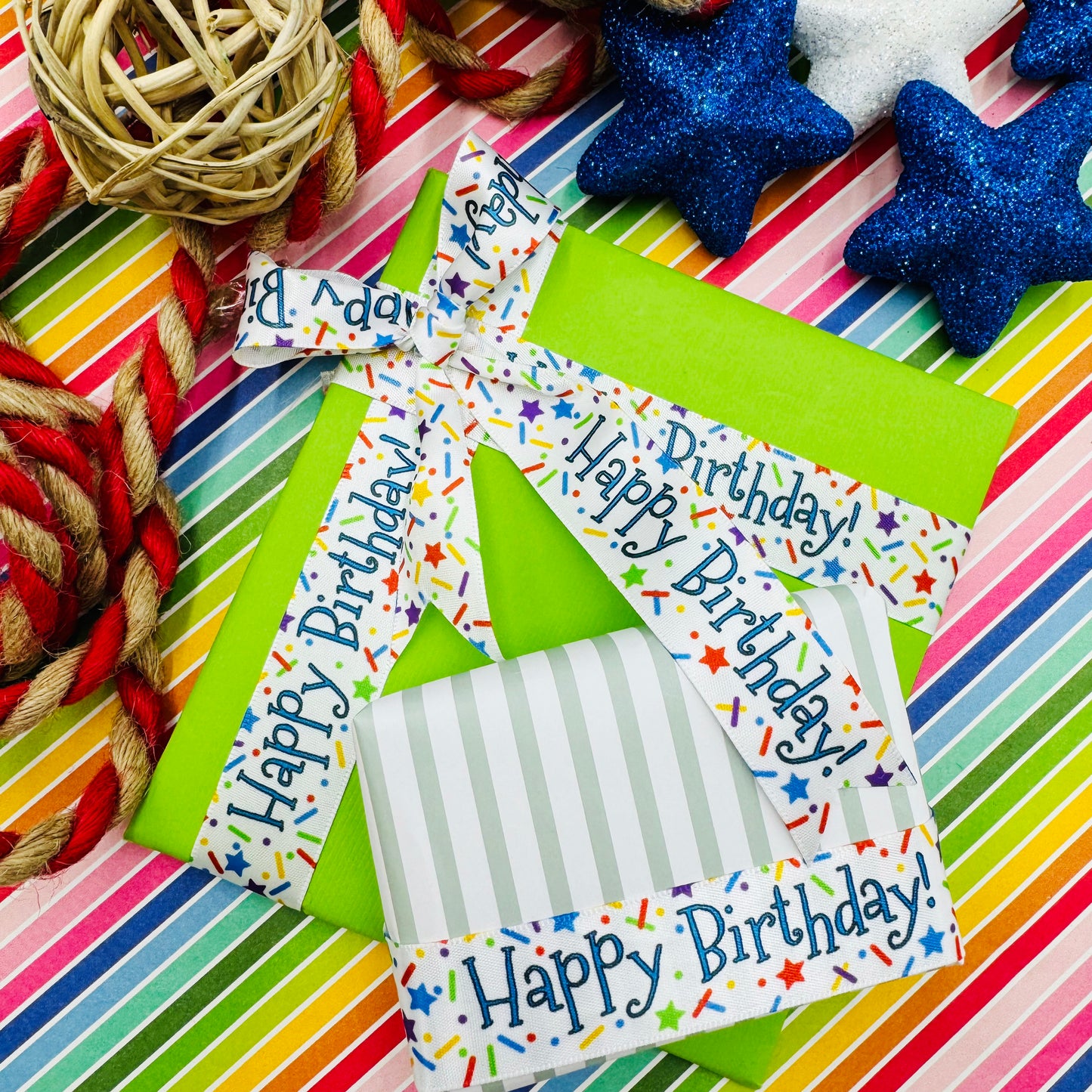 Happy Birthday ribbon with sprinkles and stars confetti in primary colors printed on 5/8" and 7/8" white satin