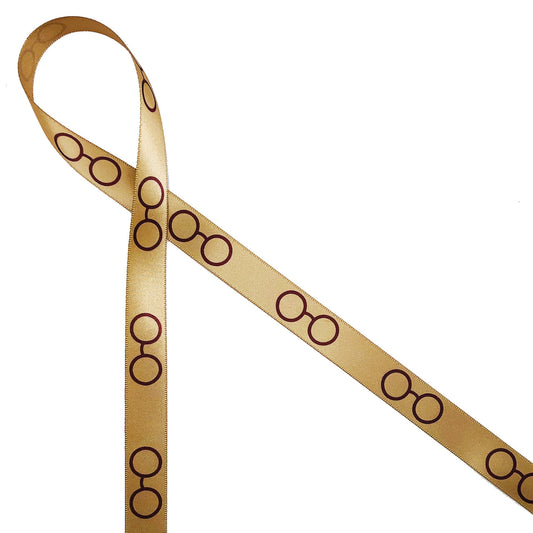 Wizard spectacles in burgundy printed on 5/8" dijon gold single face satin ribbon is such a fun addition to our Harry Potter themed collection. Be sure to have this fun ribbon on hand for wizard themed crafts and parties! Our ribbon is designed and printed in the USA