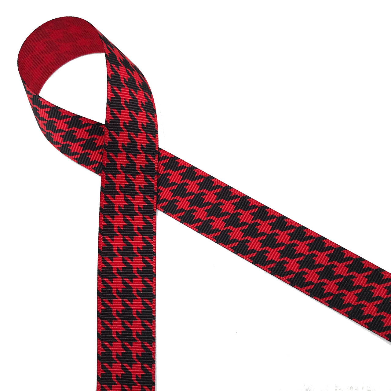 Houndstooth check in black printed on 1.5" red grosgrain ribbon is a classic print for Holidays and everyday use. This is an ideal ribbon for hair bows,  holiday gifts, wreath making, decorating and sewing projects! Our ribbon is designed and printed in the USA
