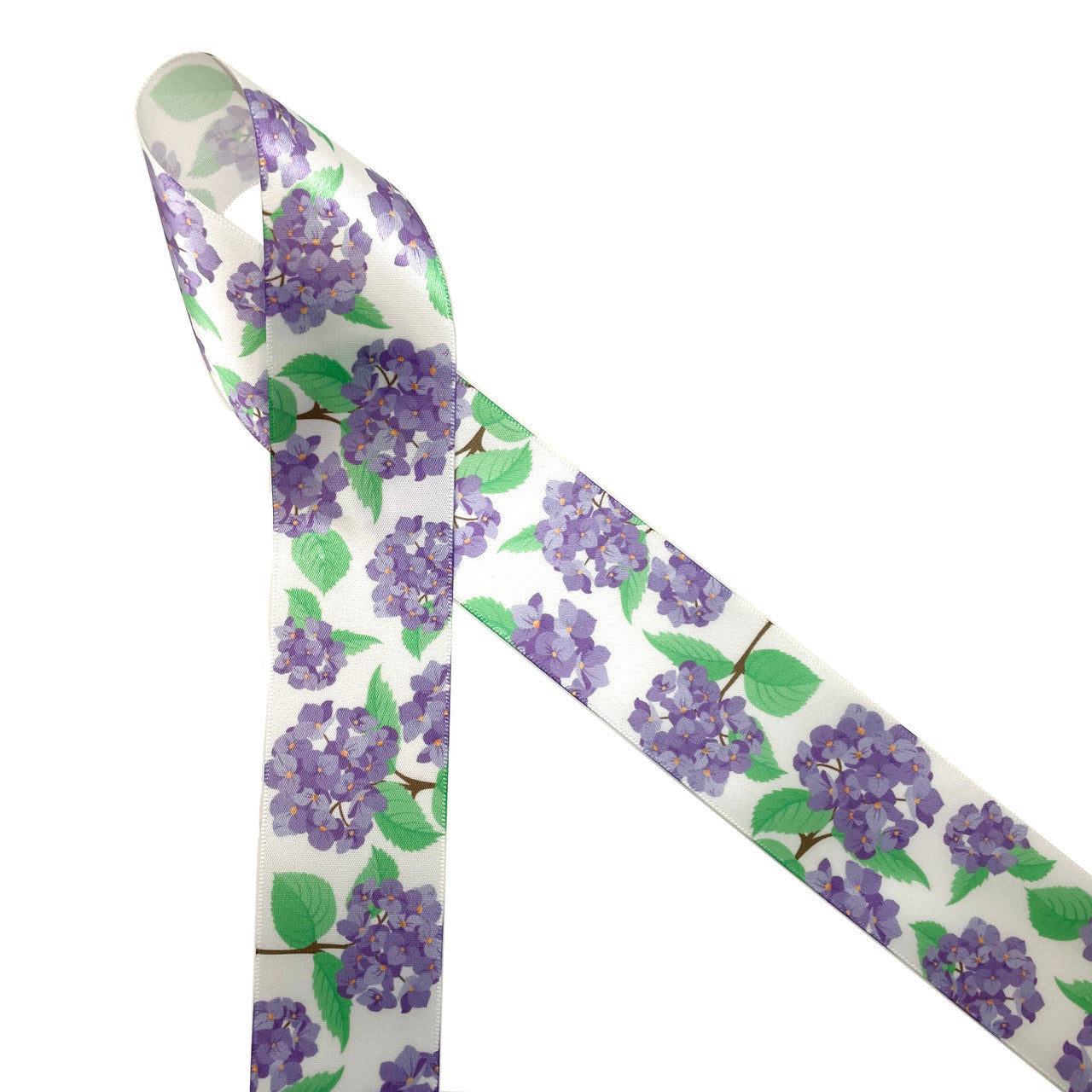 Purple hydrangea blossoms with green leaves printed on 1.5" white single face satin ribbon is the perfect ribbon for Spring and Summer crafting! This is the perfect ribbon for gift wrap, hair bows, hat bands, head bands and quilting. This is a great ribbon for Mother's Day and Summer bridal showers too! All our ribbon is designed an printed in the USA
