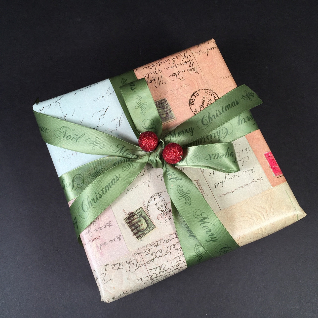 An elegant vintage gift tied with our tone on tone green satin ribbon.