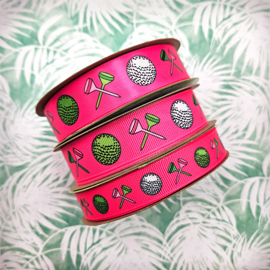 Golf ribbon Women's golf featuring golf balls and crossed tees on a hot pink background printed on 5/8" and 7/8" white grosgrain or white satin