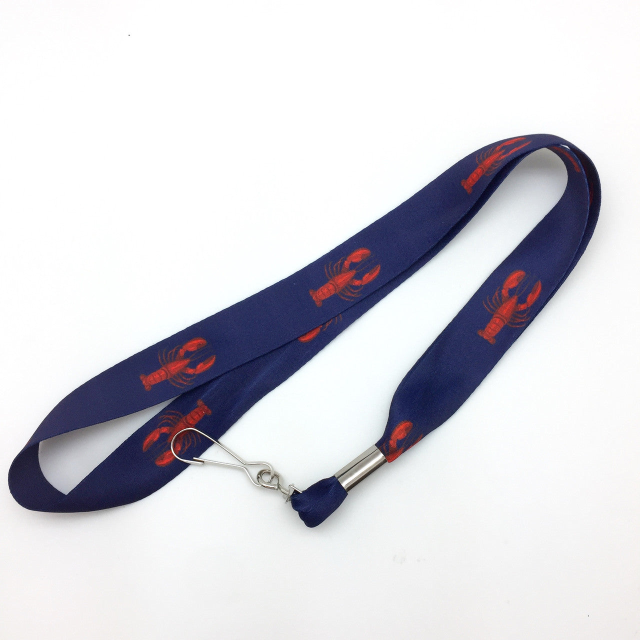 Bright red lobsters on a 1" x 17" lanyard are ready to hold your keys or work ID's! Designed, printed and assembled in the USA