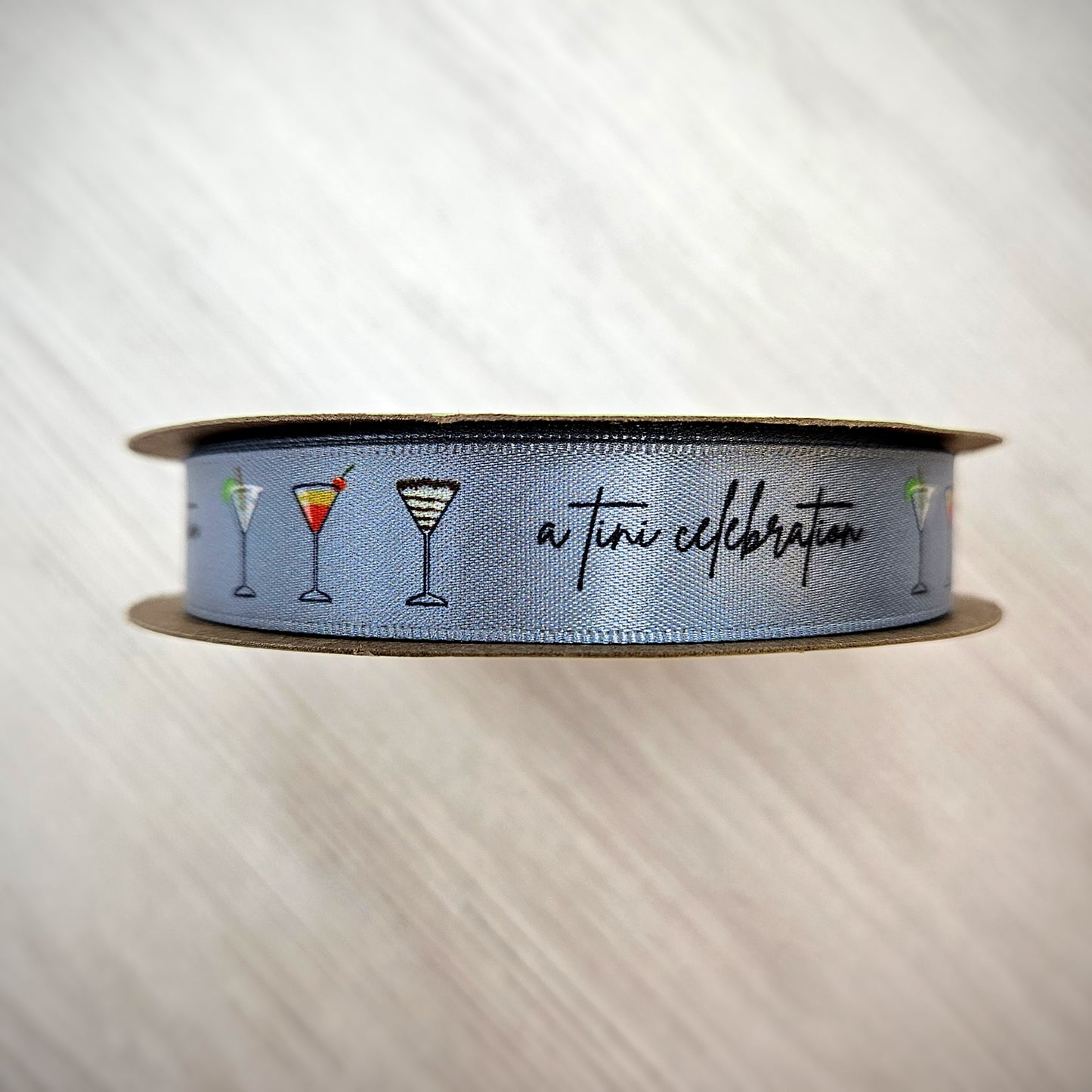 Martini Ribbon featuring Martini Glasses with the tag line A tini celebration on a silver gray background on 5/8" single face satin