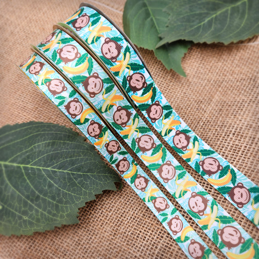 Monkeys and bananas ribbon with palm fronds on 7/8" white single face satin and grosgrain