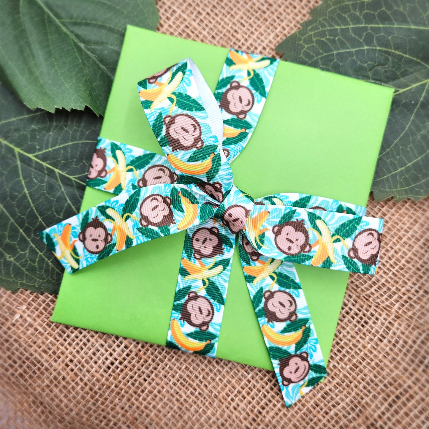 Monkeys and bananas ribbon with palm fronds on 7/8" white single face satin and grosgrain