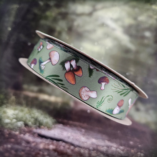 Mushroom ribbon with a variety of mushrooms tossed with forrest fern and flora printed on 7/8" white single face satin