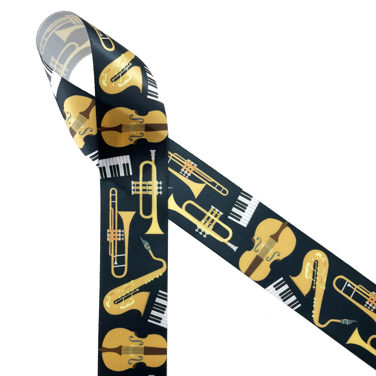Musical instrument ribbon featuring trumpet, saxophone, keyboard and strings in gold, black and white on a black background printed on 1.5" white single face satin ribbon is an ideal ribbon for all the musicians in your life. This ribbon is great for gift wrap, gift baskets, gift bags, trimming, sewing and quilting projects. Use this ribbon for musical themed crafts, wreaths and tree trimming too! All our ribbon is designed and printed in the USA